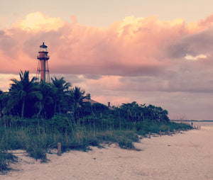Lighthouse on Sanibel Island with sunset in background